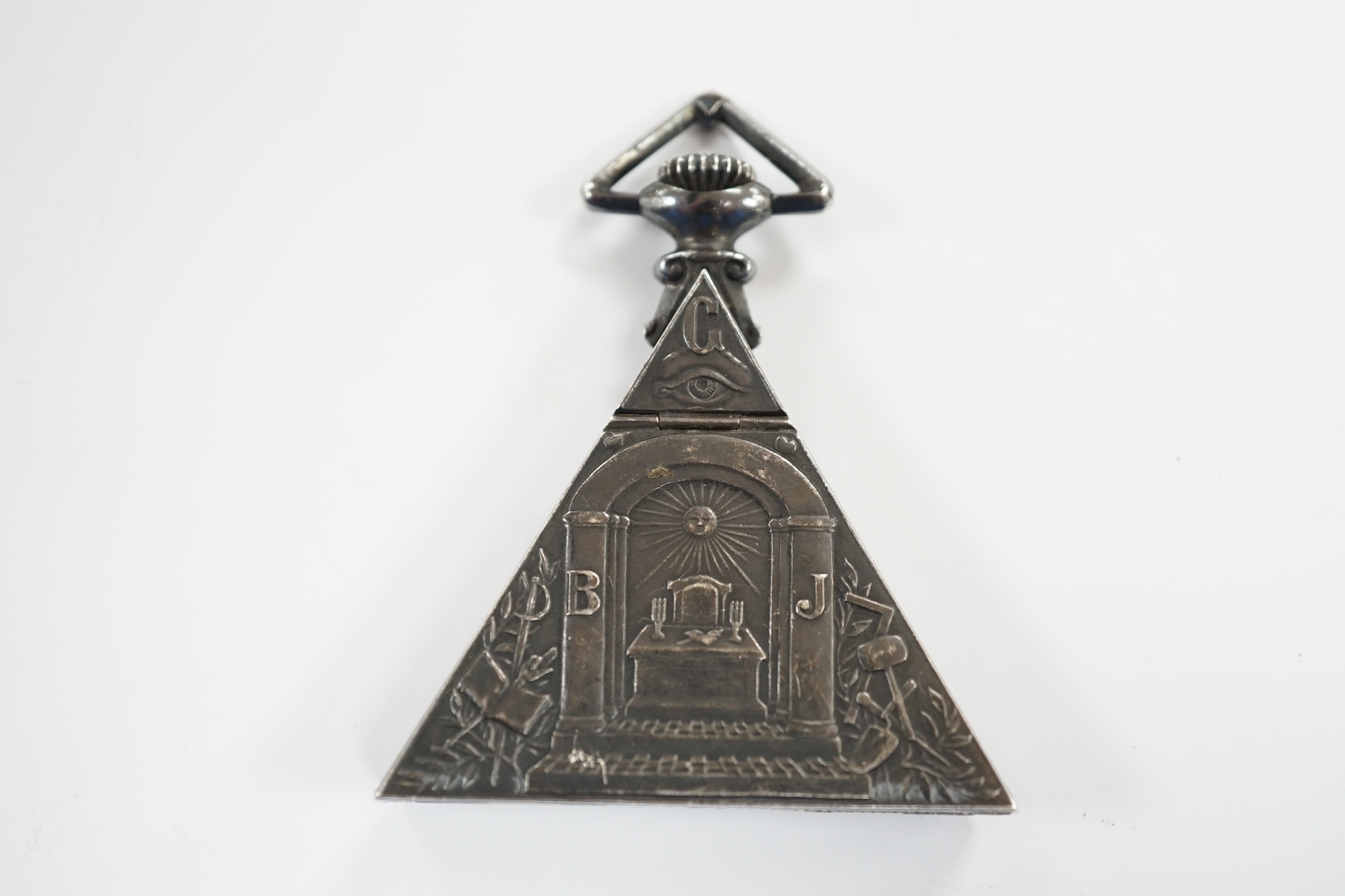 A 1920's Swiss silver triangular Masonic timepiece, with mother of pearl dial, import marks for George Stockwell, London, 1928, 0verall 65mm (lacking minute hand).